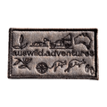 AWA Graphic embroidered travel patch featuring Aus Wild Adventures lettering surrounded by Uluru, a 4WD, kangaroos, compass, gum leaves and an Australia outline.