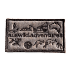AWA Graphic embroidered travel patch featuring Aus Wild Adventures lettering surrounded by Uluru, a 4WD, kangaroos, compass, gum leaves and an Australia outline.