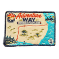 Adventure Way embroidered travel patch featuring map of the Brisbane to Adelaide route with dotted red road, coastal cities, outback trees and a compass.