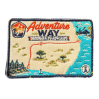 Adventure Way embroidered travel patch featuring map of the Brisbane to Adelaide route with dotted red road, coastal cities, outback trees and a compass.