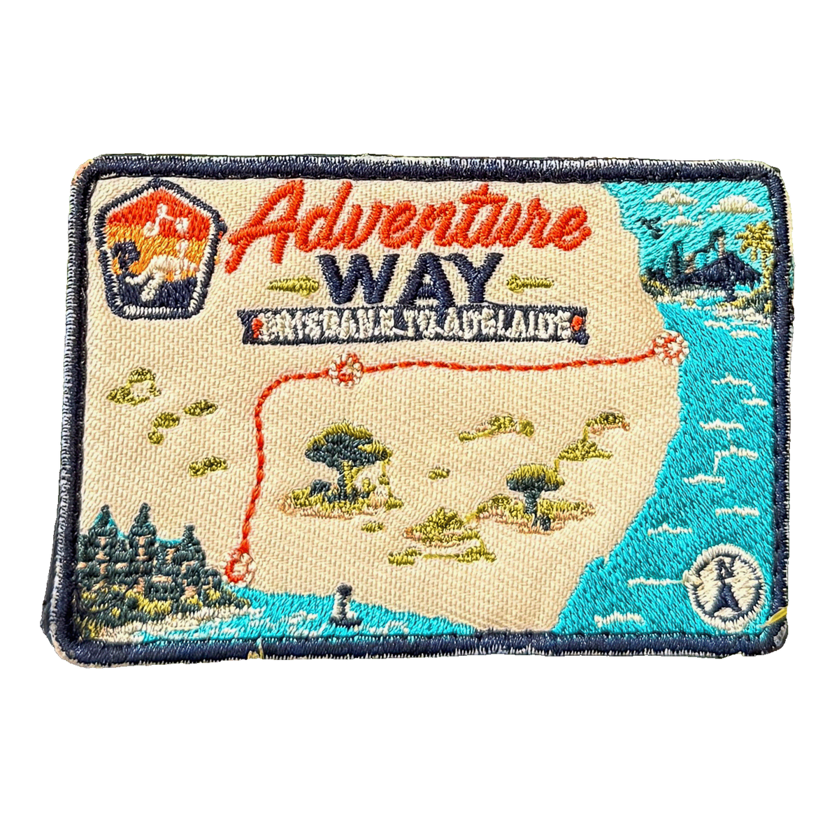 Adventure Way embroidered travel patch featuring map of the Brisbane to Adelaide route with dotted red road, coastal cities, outback trees and a compass.