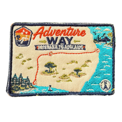 Adventure Way embroidered travel patch featuring map of the Brisbane to Adelaide route with dotted red road, coastal cities, outback trees and a compass.