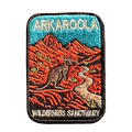 Arkaroola embroidered travel patch featuring kangaroo beside a winding track through rugged red mountains beneath a teal sky.
