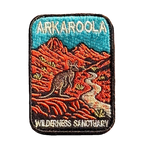Arkaroola embroidered travel patch featuring kangaroo beside a winding track through rugged red mountains beneath a teal sky.