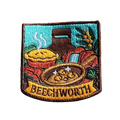 Beechworth embroidered travel patch featuring gold pan, steaming pie, historic chimney, waterfall and native wattle flowers.