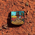Beechworth embroidered travel patch featuring gold pan, steaming pie, historic chimney, waterfall and native wattle flowers.