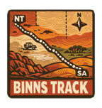Binns Track illustrated travel patch design featuring 4WD and dotted route crossing red desert country between the Northern Territory and South Australia.