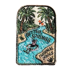 Bitter Springs embroidered travel patch featuring snorkeller floating through turquoise thermal pools surrounded by tropical palms.