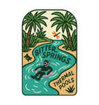 Bitter Springs illustrated travel patch design featuring snorkeller floating through turquoise thermal pools surrounded by tropical palms.