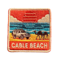 Broome - Cable Beach embroidered travel patch featuring 4WD and two camels on golden sand beside turquoise ocean at sunset.