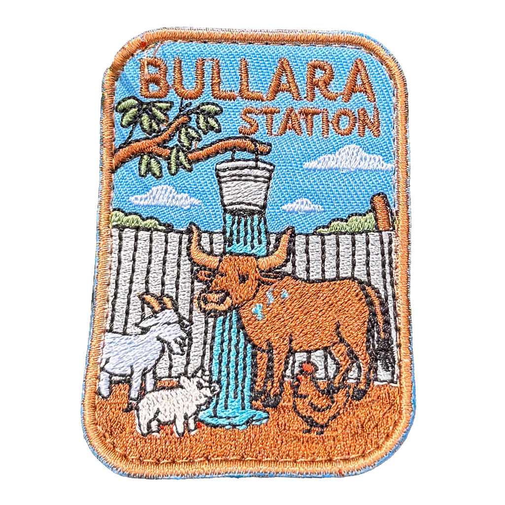 Bullara Station embroidered travel patch with a windmill and rustic outback station scenery; photographed on a transparent background.