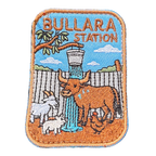 Bullara Station embroidered travel patch with a windmill and rustic outback station scenery; photographed on a transparent background.