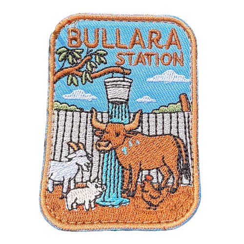 Bullara Station embroidered travel patch with a windmill and rustic outback station scenery; photographed on a transparent background.