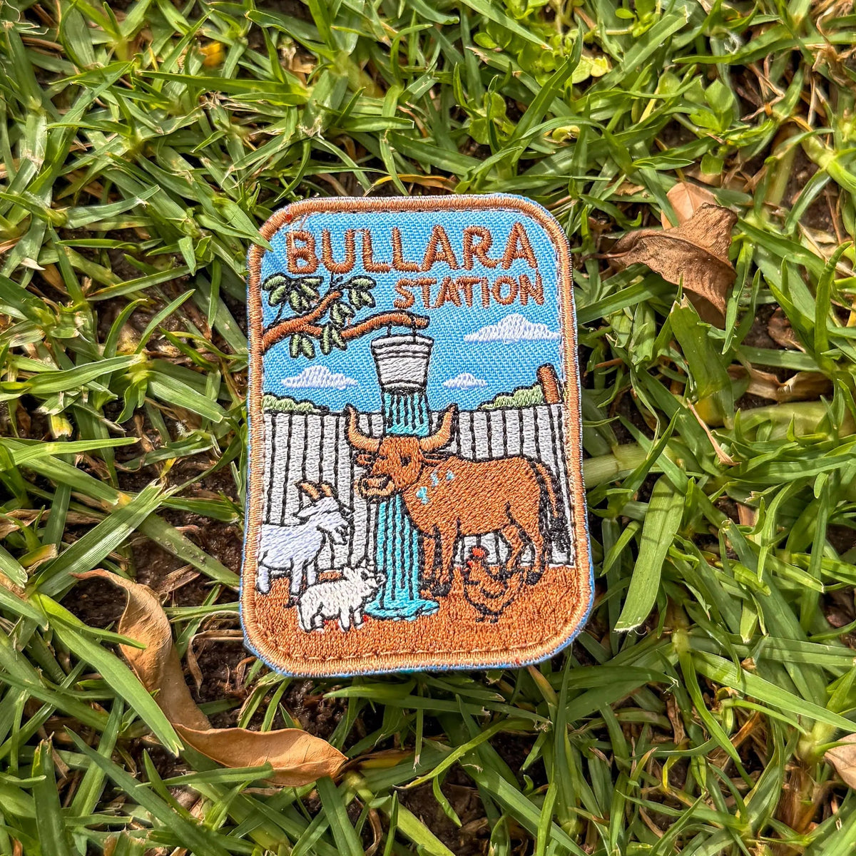 Bullara Station embroidered travel patch with a windmill and rustic outback station scenery.