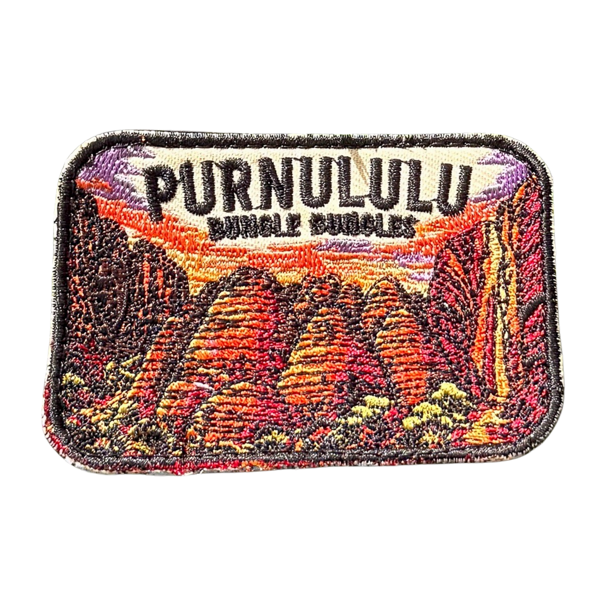 Bungle Bungles (Purnululu) embroidered travel patch with striped sandstone domes of the Bungle Bungle Range at sunset; photographed on a transparent background.