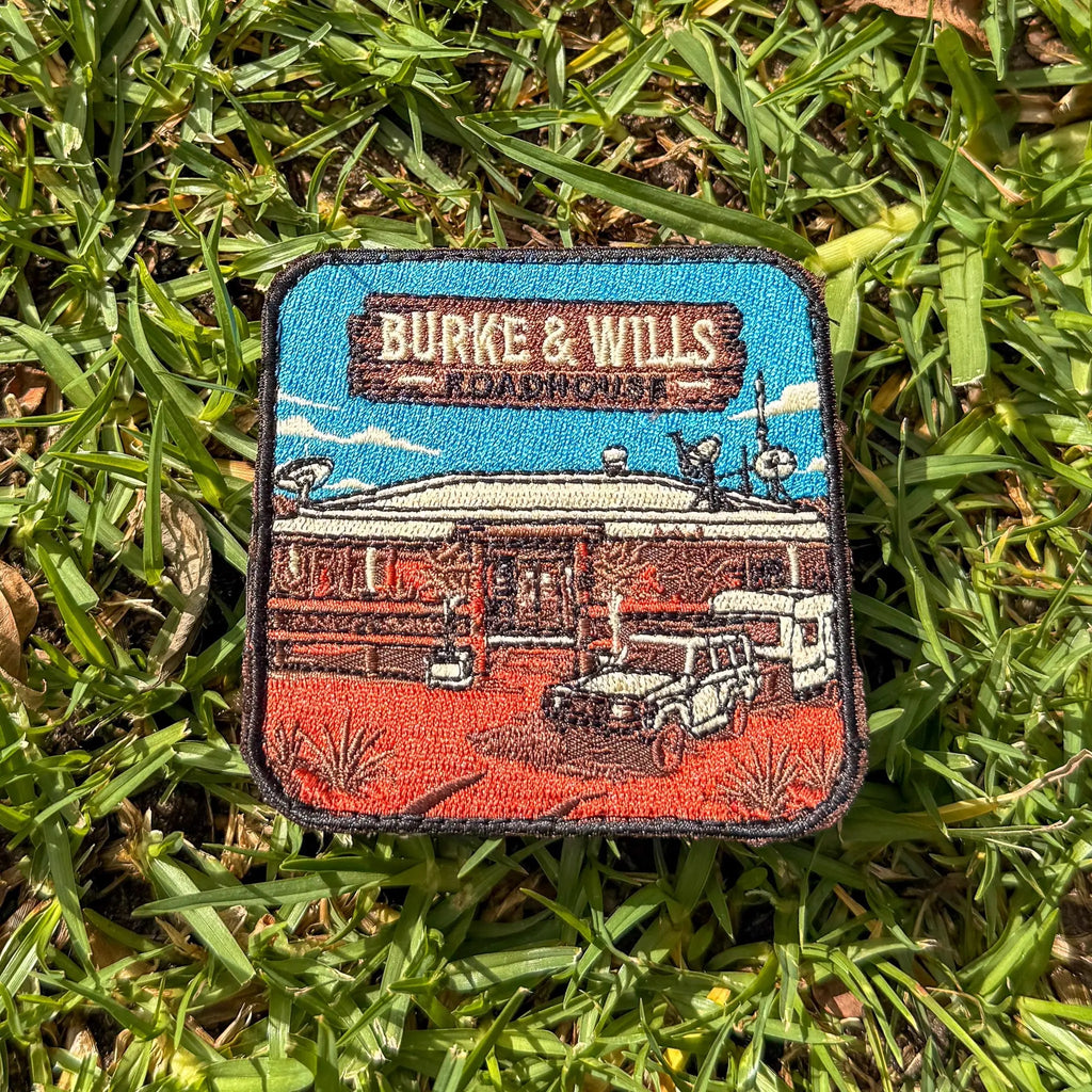 Burke And Wills Roadhouse embroidered travel patch with a remote roadhouse in red outback country.