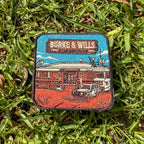 Burke And Wills Roadhouse embroidered travel patch with a remote roadhouse in red outback country.