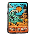 Byron Bay embroidered travel patch with Cape Byron Lighthouse above the coast; photographed on a transparent background.