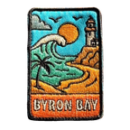 Byron Bay embroidered travel patch with Cape Byron Lighthouse above the coast; photographed on a transparent background.