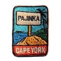 Cape York - The Tip embroidered travel patch with the Tip of Australia sign in a tropical coastal setting; photographed on a transparent background.