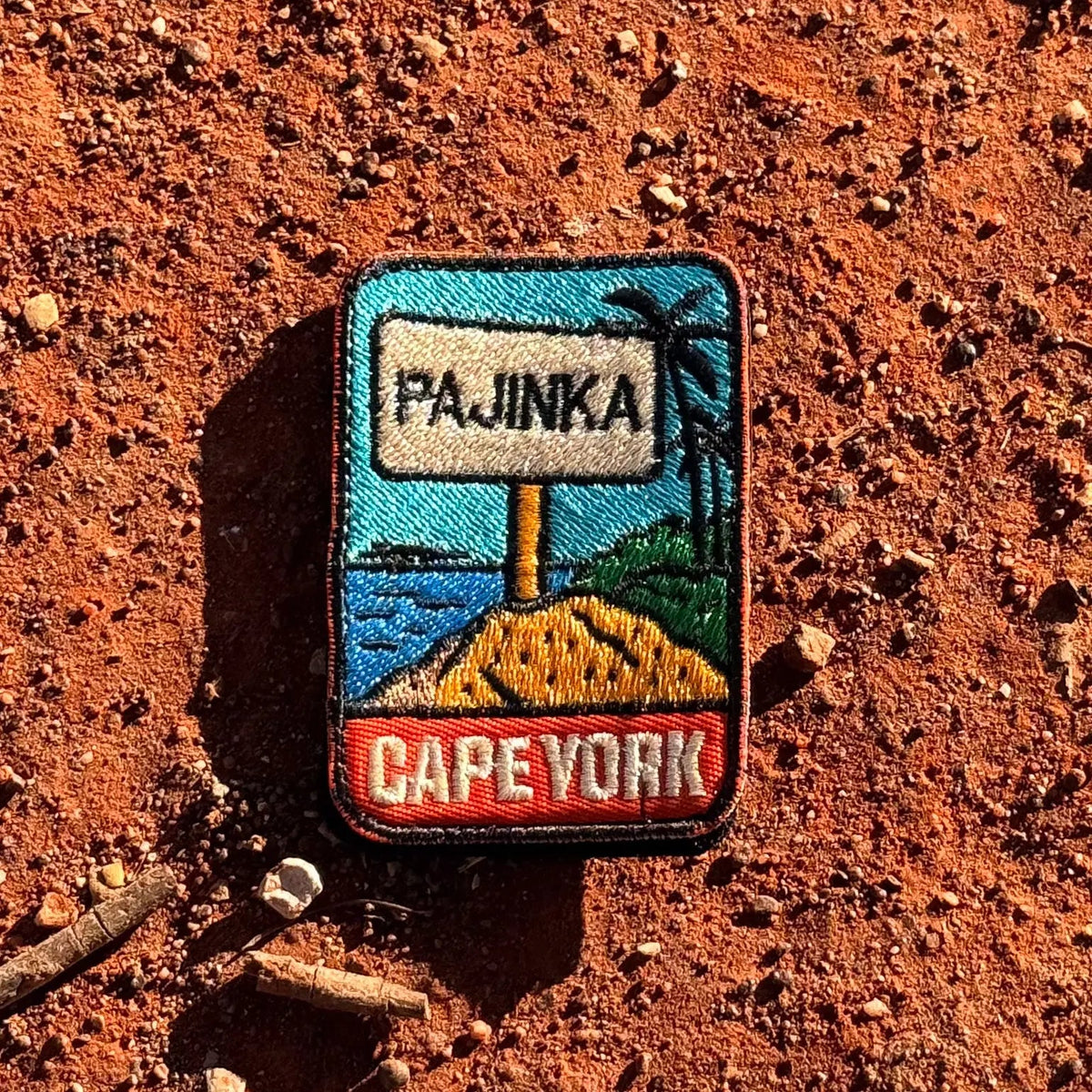 Cape York - The Tip embroidered travel patch with the Tip of Australia sign in a tropical coastal setting.