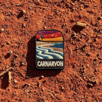 Carnarvon embroidered travel patch with a coastal jetty and palm trees.
