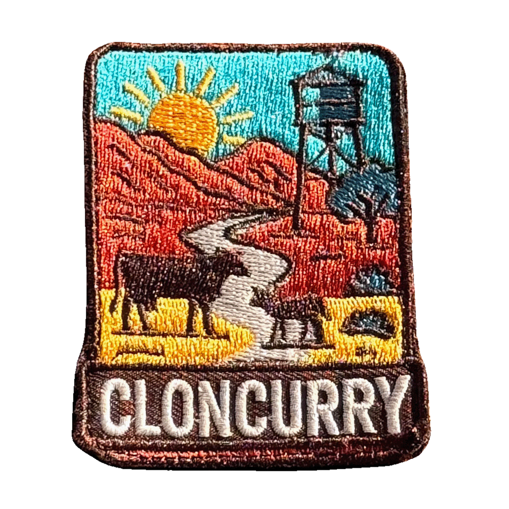 Cloncurry embroidered travel patch with red outback scenery and a mining landscape; photographed on a transparent background.