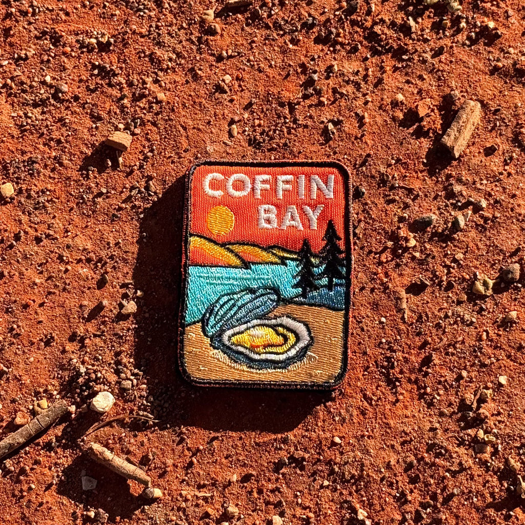 Coffin Bay embroidered travel patch with a white sandy beach and turquoise coastline.