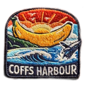 Coffs Harbour embroidered travel patch with the Big Banana landmark; photographed on a transparent background.