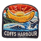 Coffs Harbour embroidered travel patch with the Big Banana landmark; photographed on a transparent background.