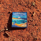 Coorong National Park embroidered travel patch with a pelican on sand dunes and a dolphin in turquoise coastal water.