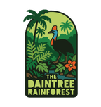 Daintree Rainforest illustrated travel patch design featuring a cassowary surrounded by tropical rainforest, palms and flowers.