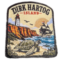 Dirk Hartog Island embroidered travel patch with a lighthouse on a rugged island coast; photographed on a transparent background.