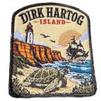 Dirk Hartog Island embroidered travel patch with a lighthouse on a rugged island coast; photographed on a transparent background.