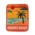 Dundee Beach embroidered travel patch with a tropical beach with palm trees; photographed on a transparent background.
