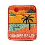 Dundee Beach embroidered travel patch with a tropical beach with palm trees; photographed on a transparent background.