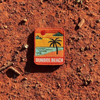 Dundee Beach embroidered travel patch with a tropical beach with palm trees.