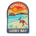 Esperance - Lucky Bay embroidered travel patch with a kangaroo on the white sand of Lucky Bay beside turquoise water; photographed on a transparent background.