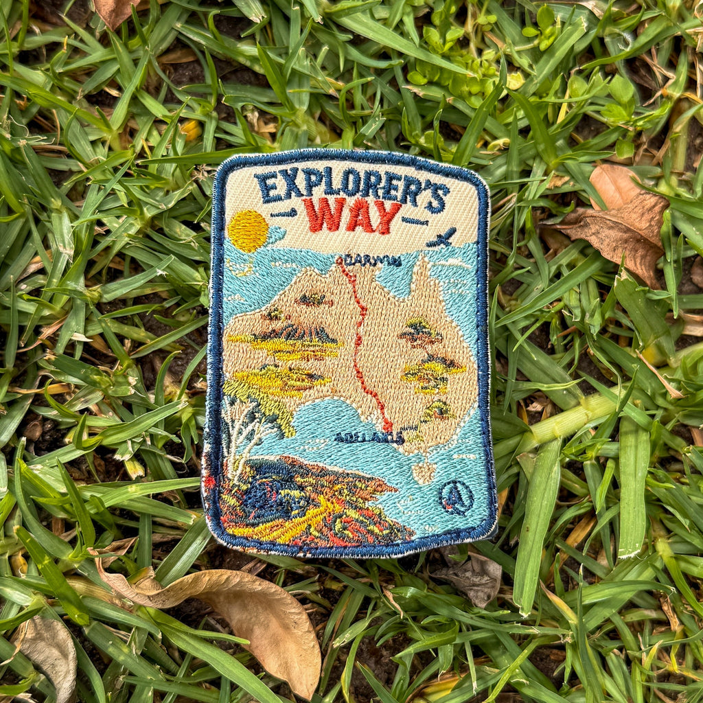 Explorers Way embroidered travel patch with an outback road through red desert country.