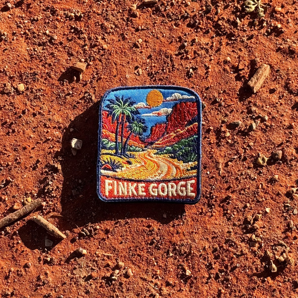 Finke Gorge embroidered travel patch with red gorge walls and desert vegetation.