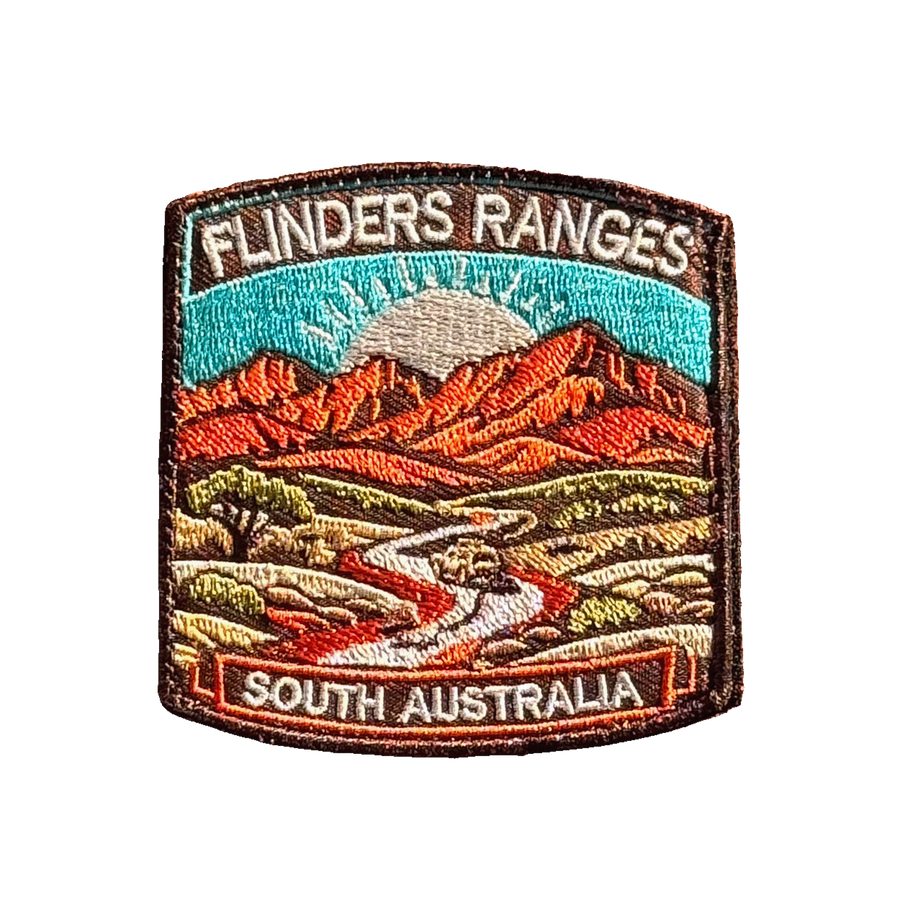 Flinders Ranges embroidered travel patch with rugged red mountain ranges; photographed on a transparent background.