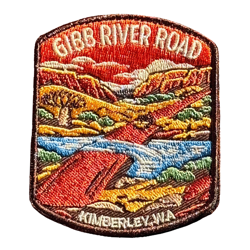 Gibb River Road embroidered travel patch with a four-wheel drive on a remote Kimberley river crossing; photographed on a transparent background.