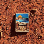 Gnaraloo Station embroidered travel patch with a breaking ocean wave along a rugged coastline.