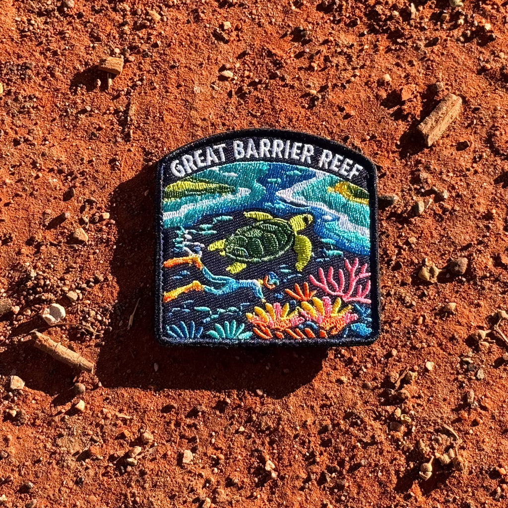 Great Barrier Reef embroidered travel patch with a sea turtle above a colourful coral reef.