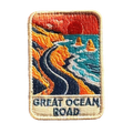 Great Ocean Road embroidered travel patch with the Twelve Apostles sea stacks beside the ocean; photographed on a transparent background.