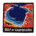 Gulf of Carpentaria embroidered travel patch with a barramundi and tropical coastline; photographed on a transparent background.