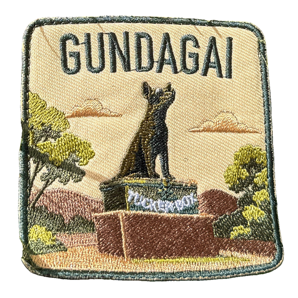 Gundagai embroidered travel patch with the Dog on the Tuckerbox monument; photographed on a transparent background.