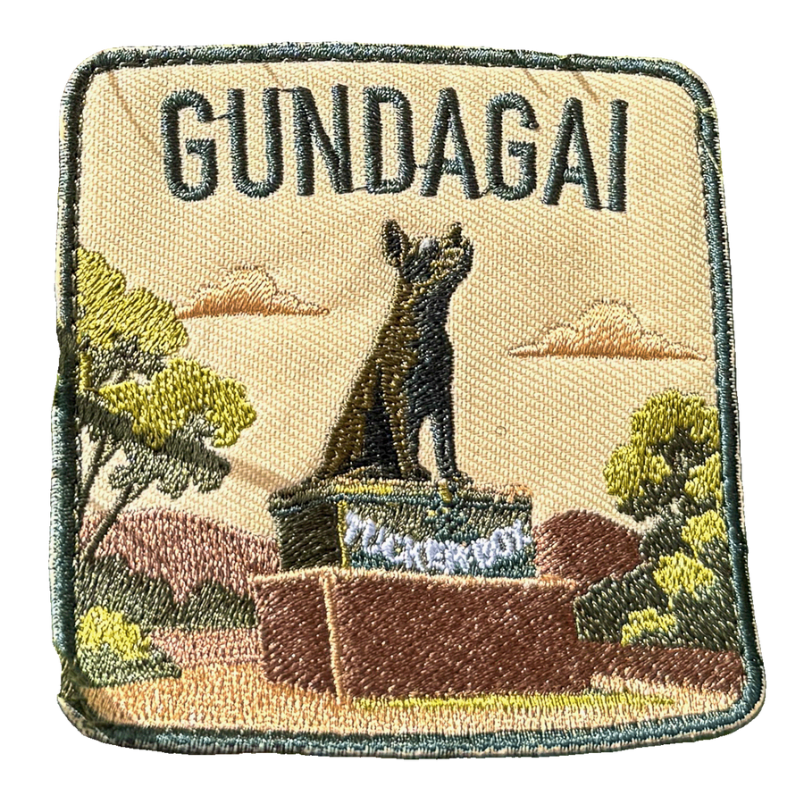 Gundagai embroidered travel patch with the Dog on the Tuckerbox monument; photographed on a transparent background.