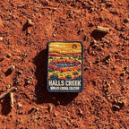 Halls Creek - Wolfe Creek Crater embroidered travel patch with the circular Wolfe Creek Crater in a red desert landscape.