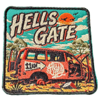Hells Gate embroidered travel patch with a rusty outback vehicle beside an 11 km sign at Hells Gate; photographed on a transparent background.